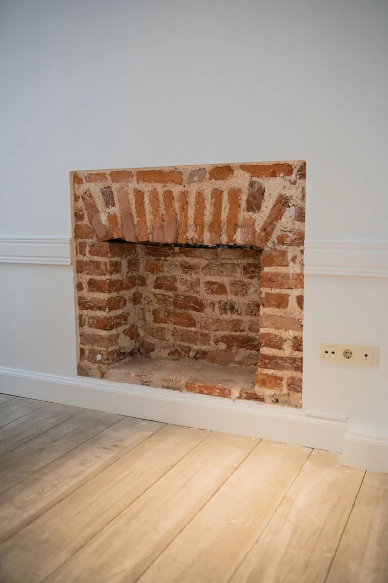 Brick fireplace opening showing the masonry around the firebox